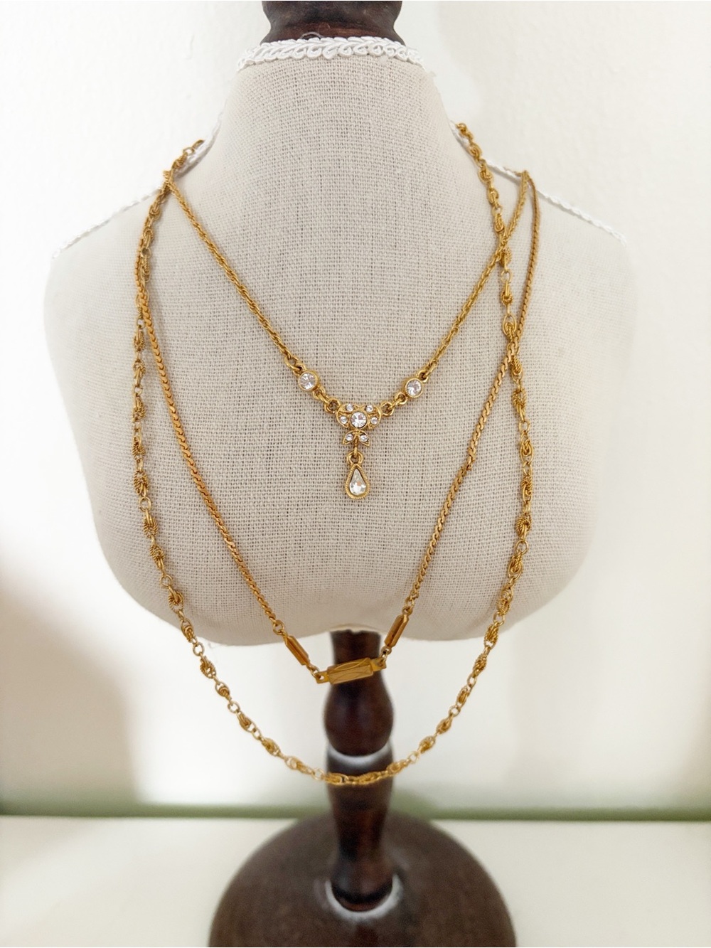Layered trio of Vintage 70s gold tone necklaces including vendome